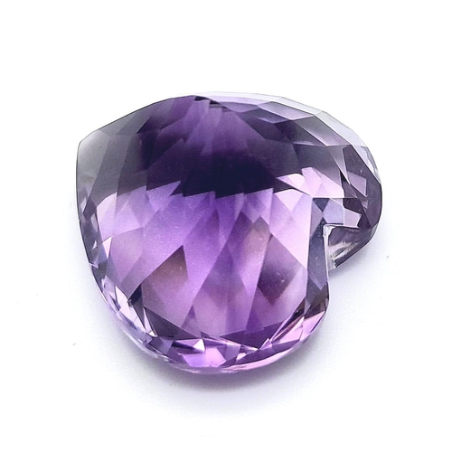 410 - A large (30.96 carats), heart shaped mix cut, amethyst, dimensions: 20.64 x 21.31 x 14.83 mm, good u... 