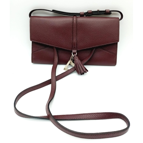 438 - A Lance Burgundy Leather Hand/Shoulder Flap Bag. Textured leather exterior. Soft red textile interio... 