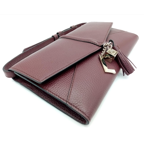 438 - A Lance Burgundy Leather Hand/Shoulder Flap Bag. Textured leather exterior. Soft red textile interio... 