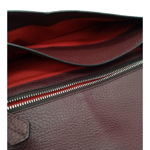 438 - A Lance Burgundy Leather Hand/Shoulder Flap Bag. Textured leather exterior. Soft red textile interio... 