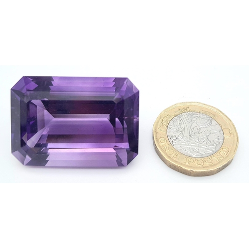 444 - A large (92.03 carats), octagonal step cut AMETHYST, with excellent vivid and uniform colouration an... 