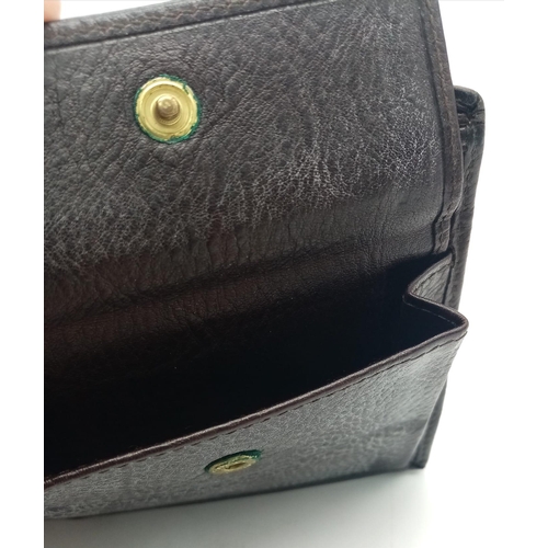 407 - A dark brown leather Gucci card wallet, 3 card holders with a popper pocket. Size approx. 11x9x2cm. ... 