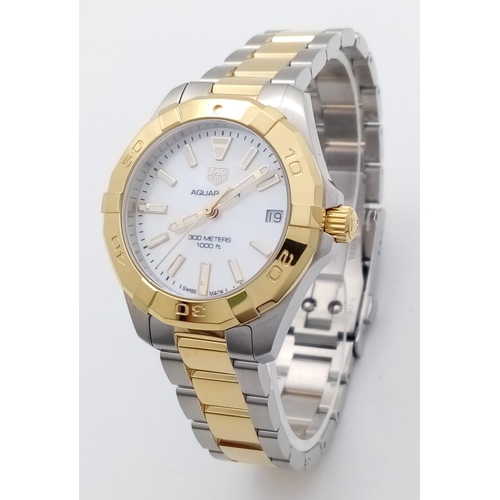 73 - A Tag Heuer Aquaracer Ladies Quartz Watch. Two tone gold plated steel bracelet and case - 32mm. Moth... 