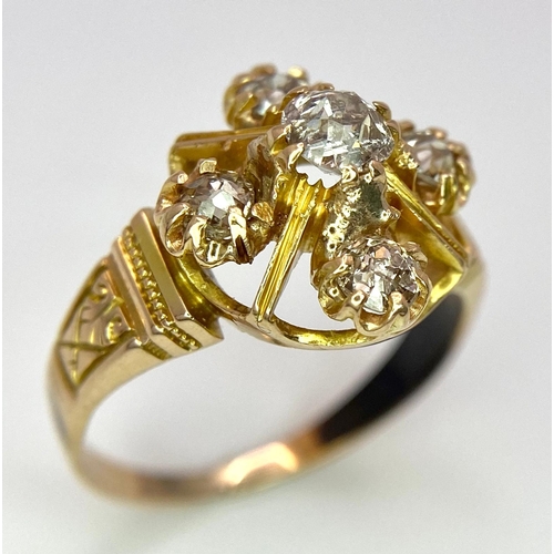 596 - A 9K Yellow Gold (tested) Diamond Ring. Five round cut diamonds on a raised setting. Size N. 4.32g t... 