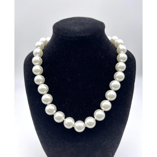 1317 - A Large White Beaded South Sea Pearl Shell Necklace. 14mm beads. Heart clasp. 42cm necklace length.