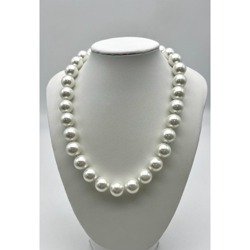 1317 - A Large White Beaded South Sea Pearl Shell Necklace. 14mm beads. Heart clasp. 42cm necklace length.