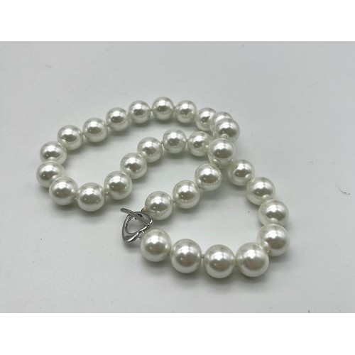 1317 - A Large White Beaded South Sea Pearl Shell Necklace. 14mm beads. Heart clasp. 42cm necklace length.