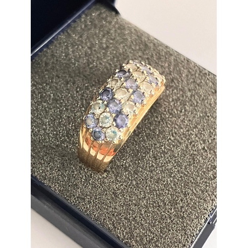 14 - Magnificent  9 carat YELLOW GOLD RING set with BLUE and WHITE GEMSTONES. 3.75 grams. Size R.