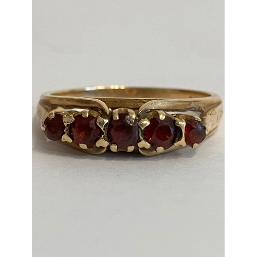 273 - 9 carat YELLOW GOLD RING Having five round cut GARNETS individually mounted and set to top. Full UK ... 