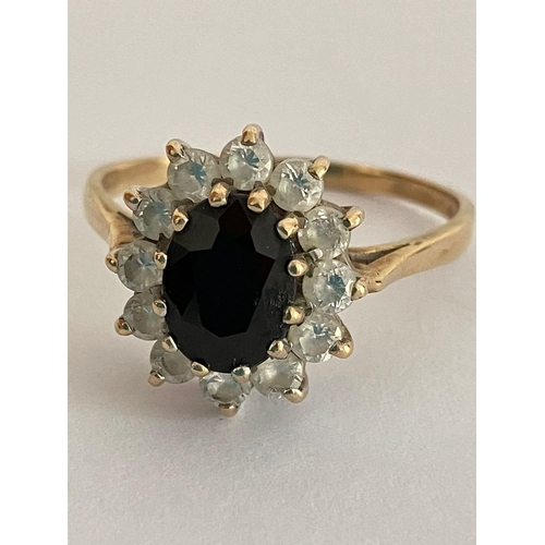 70 - Impressive 9 carat GOLD RING, Having an oval cut SPINEL to centre with clear stone surround. 2.76 gr... 