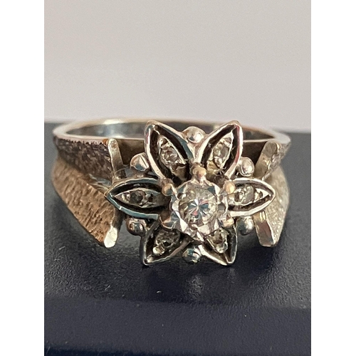 91 - Impressive 18 carat WHITE GOLD and DIAMOND RING. Having seven DIAMONDS mounted to top in floral form... 