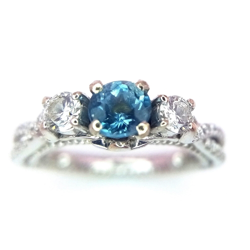 103 - A STUNNING 18K WHITE GOLD DIAMOND & TOPAZ TRILOGY RING, APPROX 0.40CT TOPAZ CENTRE AND 0.45CT DIAMON... 