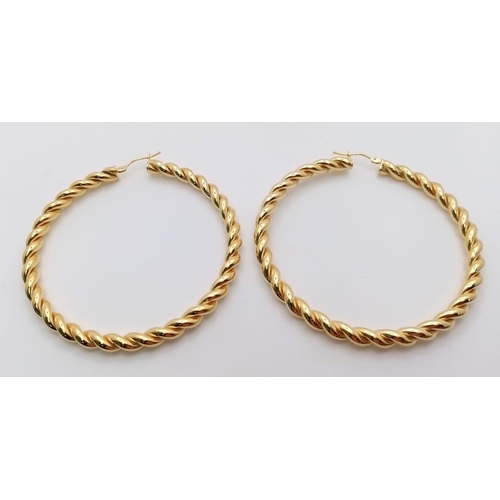 131 - A PAIR OF 9K YELLOW GOLD LARGE TWIST HOOP EARRINGS 6.1G