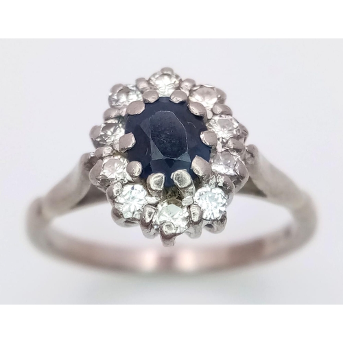 145 - A VINTAGE 18K WHITE GOLD DIAMOND & SAPPHIRE CLUSTER RING, WITH APPROX 0.40CT SAPPHIRE CENTRE AND 0.3... 