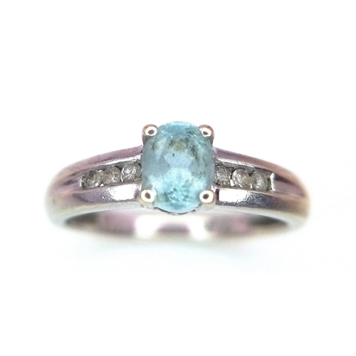 178 - A 9K WHITE GOLD AQUAMARINE AND DIAMOND RING .  2.1gms   size I