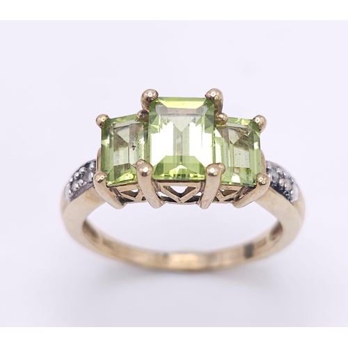 185 - A 9K GOLD PERIDOT AND DIAMOND RING .  3.1gms   size N