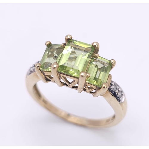 185 - A 9K GOLD PERIDOT AND DIAMOND RING .  3.1gms   size N