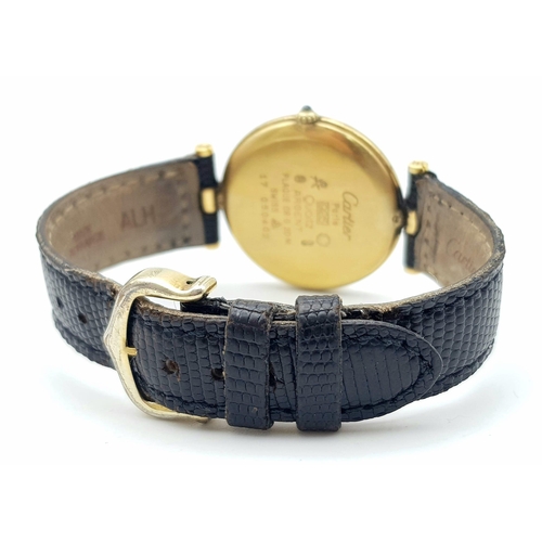 193 - A Vintage (1980s) Must de Cartier Gold Plated Quartz Ladies Watch. Black leather strap. Gold plated ... 