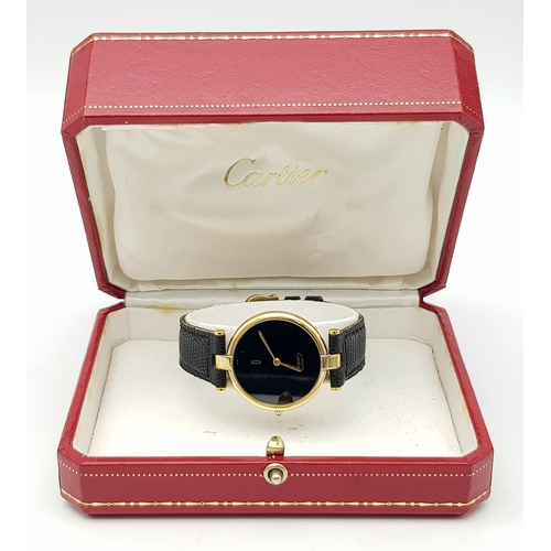 193 - A Vintage (1980s) Must de Cartier Gold Plated Quartz Ladies Watch. Black leather strap. Gold plated ... 