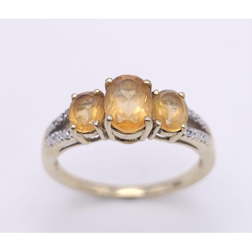 232 - A 10K GOLD CITRINE AND DIAMOND RING .  2.4gms   size N