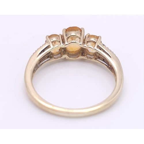 232 - A 10K GOLD CITRINE AND DIAMOND RING .  2.4gms   size N