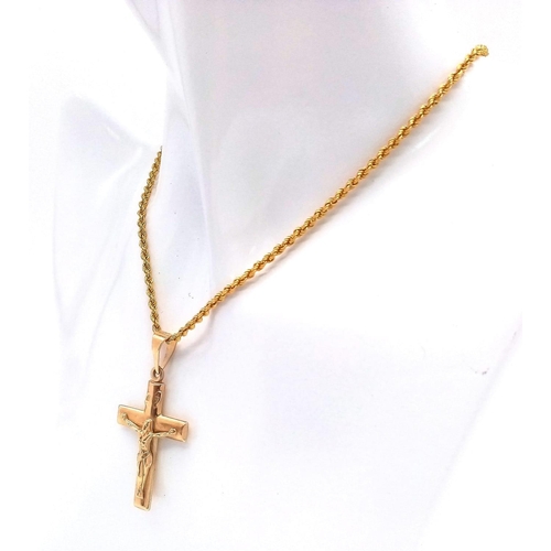 283 - A 9K GOLD CRUCIFIX ON A 9K GOLD 40cms TWIST ROPE CHAIN .   4.1gms