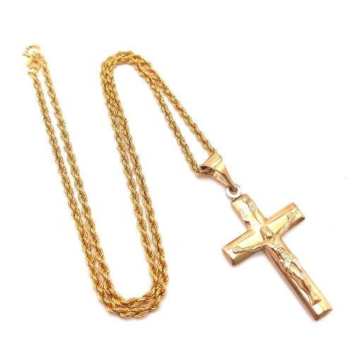 283 - A 9K GOLD CRUCIFIX ON A 9K GOLD 40cms TWIST ROPE CHAIN .   4.1gms