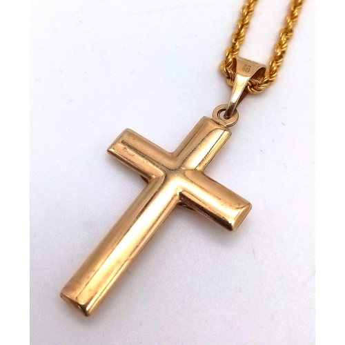 283 - A 9K GOLD CRUCIFIX ON A 9K GOLD 40cms TWIST ROPE CHAIN .   4.1gms