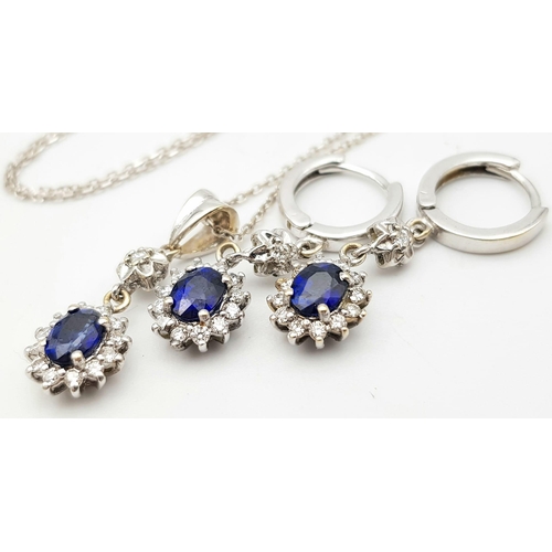 295 - An 18K White Gold, Diamond and Sapphire Jewellery Set. Oval cut sapphire with diamond surround on an... 