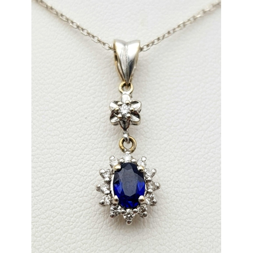 295 - An 18K White Gold, Diamond and Sapphire Jewellery Set. Oval cut sapphire with diamond surround on an... 