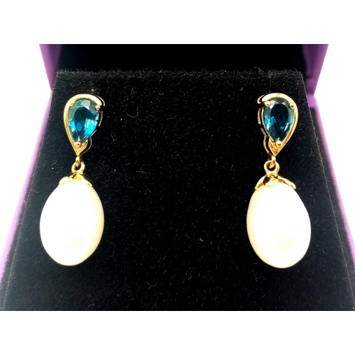 309 - A Pair of White Pearl and London Blue Topaz 9K Gold Drop Earrings. 3.6g total weight.