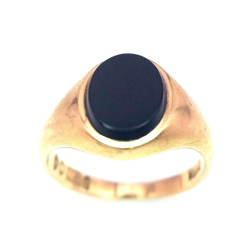 317 - A 9K GOLD RING WITH OVAL BLACK ONYX STONE .   3.6gms   size L