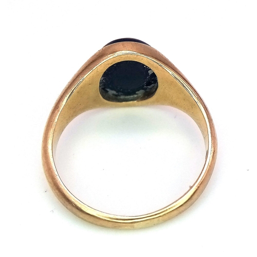 317 - A 9K GOLD RING WITH OVAL BLACK ONYX STONE .   3.6gms   size L