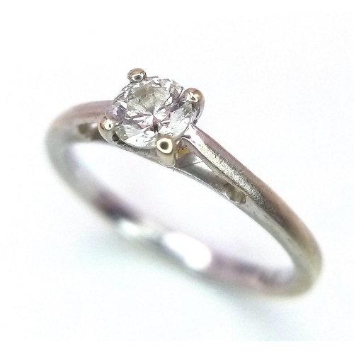 324 - A 9K WHITE GOLD DIAMOND SOLITAIRE RING .  1.4gms   size I