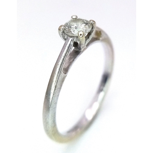 324 - A 9K WHITE GOLD DIAMOND SOLITAIRE RING .  1.4gms   size I