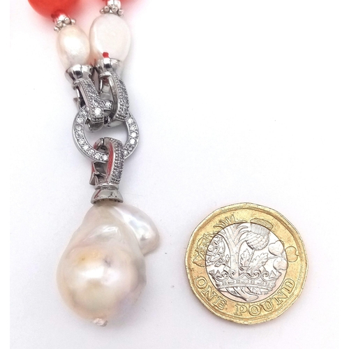 373 - A Keisha Baroque Pearl Pendant on a Fire Red Cat's Eye Beaded Necklace. Pendant - 4.5cm, white stone... 