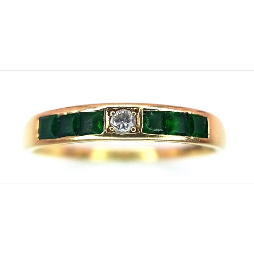 374 - An Excellent Condition 1990 Hallmarked 18 Carat Emerald and Diamond Modernist Design Ring. Set with ... 