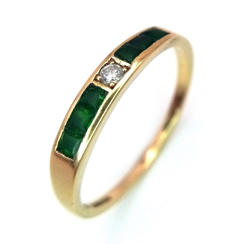 374 - An Excellent Condition 1990 Hallmarked 18 Carat Emerald and Diamond Modernist Design Ring. Set with ... 