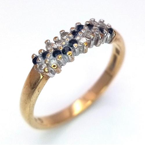 456 - A 9K GOLD RING WITH DIAMOND AND SAPPHIRE CLUSTER .   2.1gms   size M