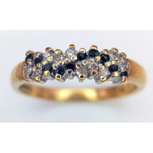 456 - A 9K GOLD RING WITH DIAMOND AND SAPPHIRE CLUSTER .   2.1gms   size M