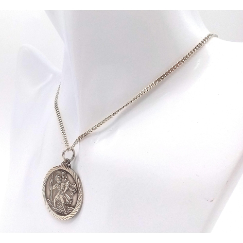 487 - A Silver Georg Jensen St. Christopher Pendant Necklace. Stamped on Obverse Side. 2.6cm Diameter on a... 