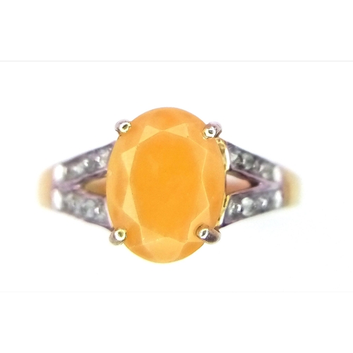 58 - A 9K GOLD AGATE AND DIAMOND RING .  1.8gms   size L