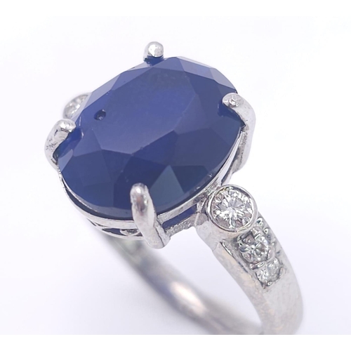 72 - An 18K White Gold Sapphire and Diamond Ring. Central 3ct sapphire with diamond accents. Size M. 4.95... 