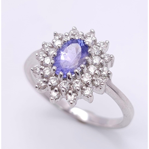 75 - A STUNNING 18K WHITE GOLD DIAMOND & TANZANITE CLUSTER RING, WITH APPROX 0.40CT TANZANITE CENTRE AND ... 