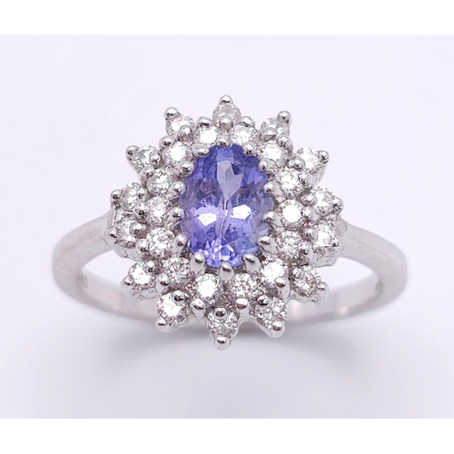 75 - A STUNNING 18K WHITE GOLD DIAMOND & TANZANITE CLUSTER RING, WITH APPROX 0.40CT TANZANITE CENTRE AND ... 