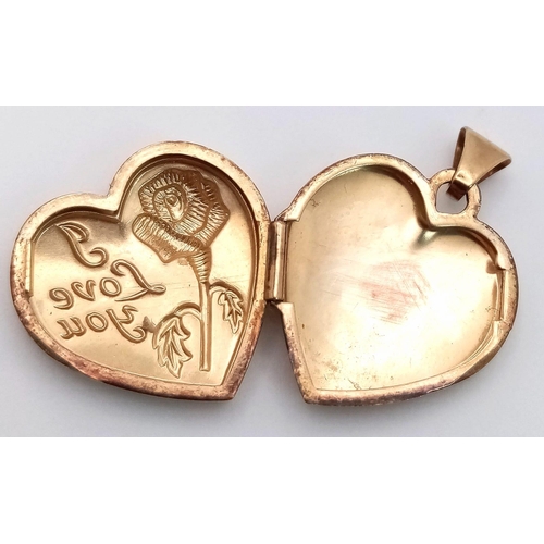 972 - AN ATTRACTIVE 9K YELLOW GOLD HEART LOCKET PENDANT, ENGRAVED WITH A ROSE AND THE WORDS I LOVE YOU, WE... 