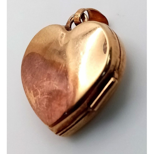 972 - AN ATTRACTIVE 9K YELLOW GOLD HEART LOCKET PENDANT, ENGRAVED WITH A ROSE AND THE WORDS I LOVE YOU, WE... 