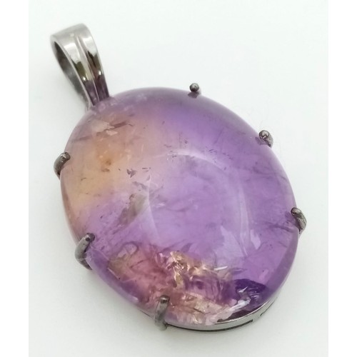 1262 - A 50ct Oval Amethyst Pendant set in 925 Sterling silver.  W-13.70g. 5cm. Comes with a presentation c... 