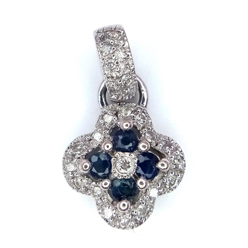 1102 - A 14K White Gold Sapphire and Diamond Small Clover Pendant. 2cm. 1.46g total weight.