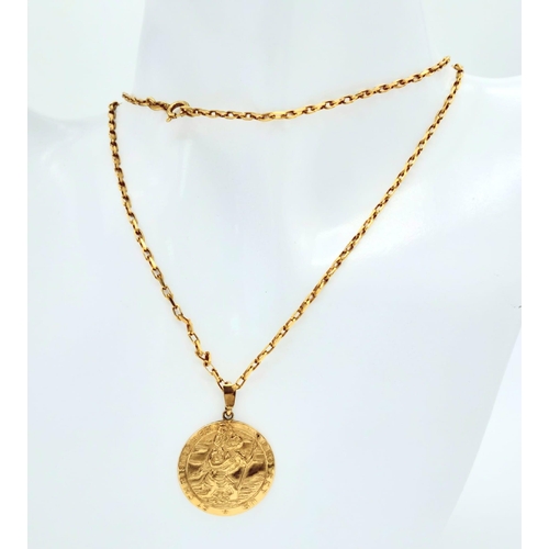 1331 - A 74cms 9K GOLD CHAIN WITH A MODERN ST. CHRISTOPHER PENDANT .  10.8gms